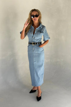 Light blue denim midi dress with short sleeves and a button-down front, styled with a relaxed fit.