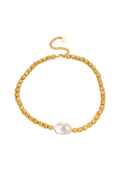 Stevie Necklace by Amber Sceats, a viral statement piece featuring a large baroque freshwater pearl with textured 24k gold pendants, perfect for elegant occasions.