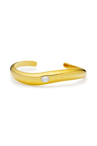 Corniglia Bracelet Gold by Amber Sceats, gold-plated cuff with cubic zirconia crystal detail, a trendy piece perfect for chic events or everyday elegance.