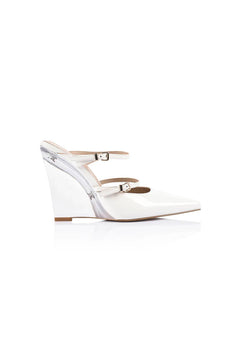 Gwen Wedge in Lucite & White Leather by Lana Wilkinson, a pointed-toe mule with adjustable strap and green lucite wedge heel.