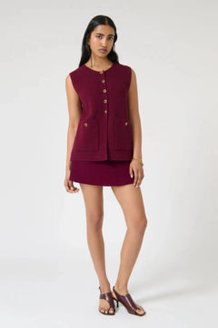 Helena Gilet – Plum by Onte, this sleeveless cotton knit features gold buttons and patch pockets. Perfect for layering all year round.