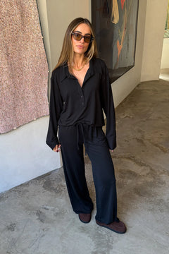 The Hunter Long Sleeve Polo Top in Black by Sneaky Link is a soft second skin essential with a flattering fit, polished collar, and easy everyday appeal.
