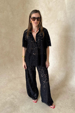 Lucy Lace Elastic Pant in Black by Sneaky Link, sheer floral lace wide-leg trousers with an easy pull-on fit. Perfect for set styling or standalone looks.