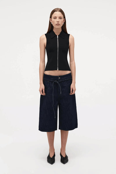 Neuw Denim Suki Zip Top in Black, a slim sleeveless knit with collared neckline and double zip closure. Perfect for modern minimalist styling.