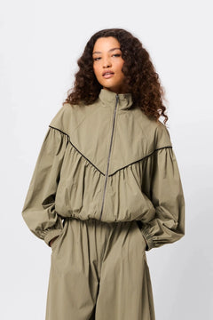 Overturn Jacket Fern by Mossman - lightweight technical jacket with funnel neckline and voluminous sleeves, perfect for modern elevated layering.