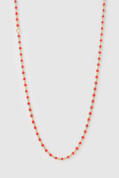 Peggy Necklace Cherry by Arms of Eve, a dainty gold chain with cherry enamel beads, perfect for summer layering and open-back looks.