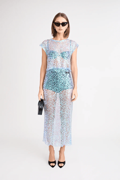 Delphine Skirt by Pfeiffer, relaxed midi length with mid-rise fit, sequin knit fabric. Ideal for layering over swimwear or briefs, 100% polyester. Spot clean only.