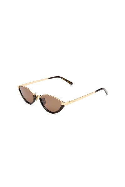 The Lia sunglasses by Luv Lou, black cat-eye frame with metal accents and debossed Organic L pattern, featuring smoke mono lenses.