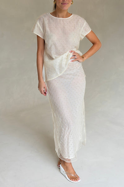 The Saasha Beaded Skirt Ivory by Solaqua – sheer beaded maxi skirt with side split and fluid silhouette.