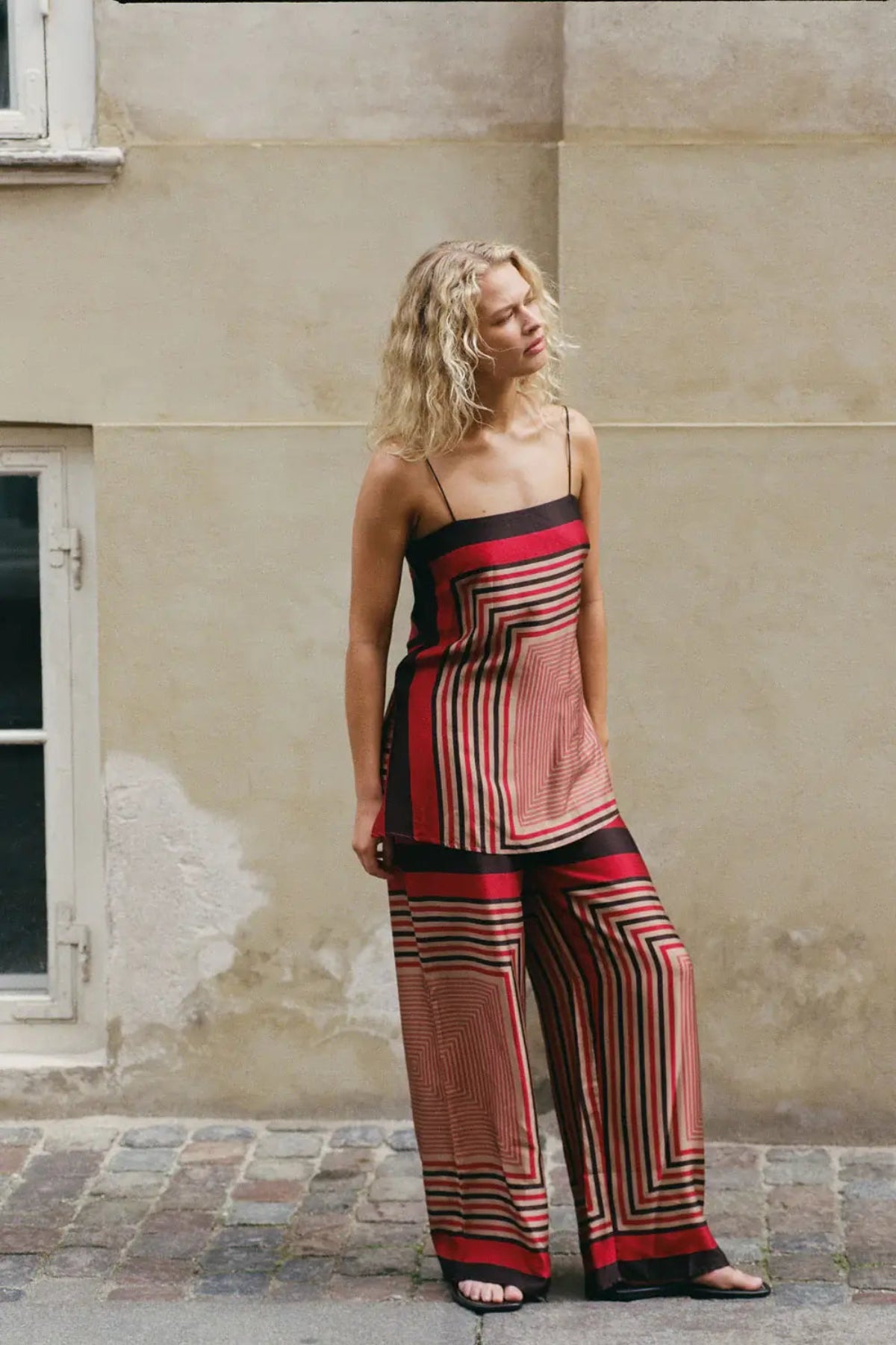 Faithfull the Brand Ylva Pant in Ylva Print, mid-rise straight leg with elastic waist in red-brown stripe. Perfect for chic co-ord styling.