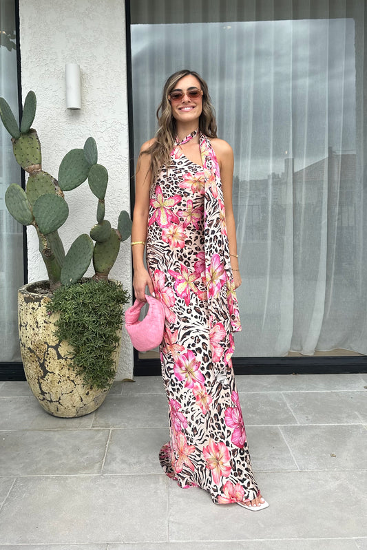 Hera Maxi Dress Safaria by Cin Cin – A trendy maxi blending vibrant floral and animal prints with a halter neckline and flowing silhouette. Perfect for resort wear and tropical events.