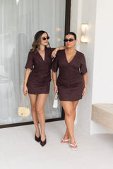 Jaz Hand Linen Ruched Mini Dress Chocolate by Sneaky Link – a fitted linen mini with V-neck and ruching. Perfect for day-to-night styling.