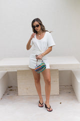 Jaz Hand Knot Mini Dress White by Sneaky Link – a mini dress with front knot and fitted shape. Perfect for day-to-night styling.
