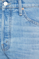 The Tomcat Roller Skimp Puzzled by MOTHER, trendy high-waisted wide-leg jeans with a button fly and light blue wash. Perfect for a relaxed, stylish look with whiskering and fading at the knees.