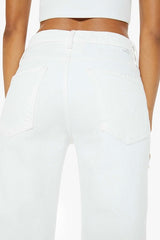 The Dodger Sneak Totally Innocent by MOTHER, trendy low-rise jeans with a slouchy, loose straight-leg fit and subtle whiskering. Perfect for casual days, offering comfort and style in a light-blue wash.