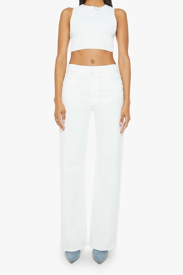 The Dodger Sneak Totally Innocent by MOTHER, trendy low-rise jeans with a slouchy, loose straight-leg fit and subtle whiskering. Perfect for casual days, offering comfort and style in a light-blue wash.