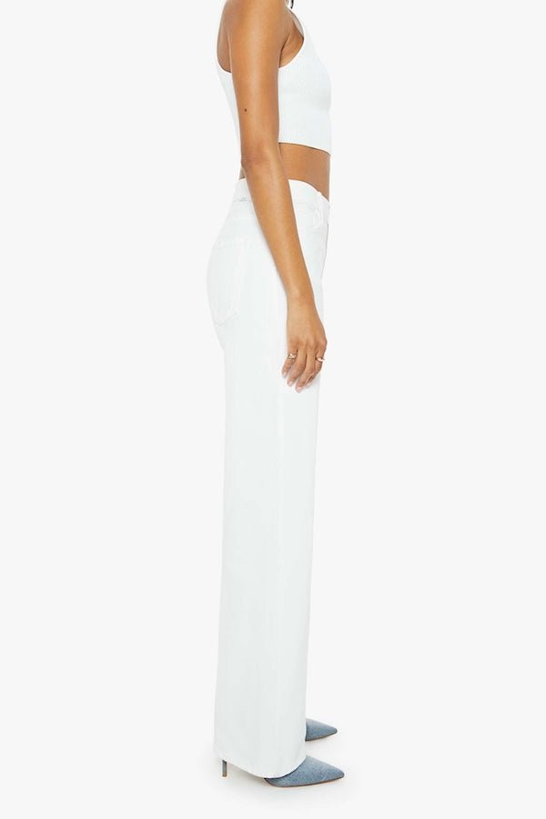 The Dodger Sneak Totally Innocent by MOTHER, trendy low-rise jeans with a slouchy, loose straight-leg fit and subtle whiskering. Perfect for casual days, offering comfort and style in a light-blue wash.