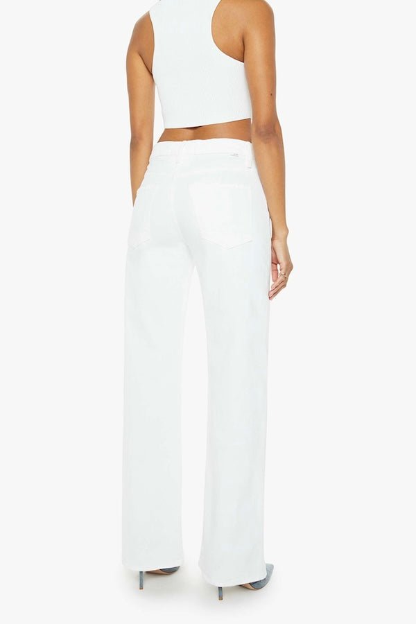 The Dodger Sneak Totally Innocent by MOTHER, trendy low-rise jeans with a slouchy, loose straight-leg fit and subtle whiskering. Perfect for casual days, offering comfort and style in a light-blue wash.