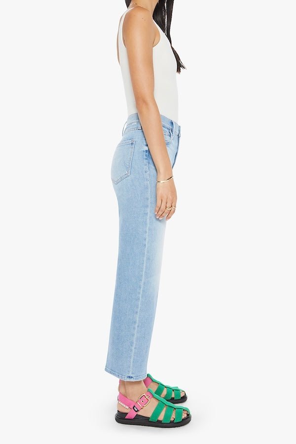 The Rambler Zip Ankle Look Ma, No Hands! by MOTHER, trendy high-waisted jeans with a wide leg and ankle cut. Perfect for a relaxed, stylish look with light-blue whiskering and fading.