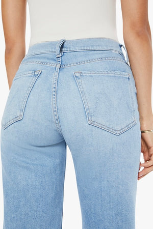The Rambler Zip Ankle Look Ma, No Hands! by MOTHER, trendy high-waisted jeans with a wide leg and ankle cut. Perfect for a relaxed, stylish look with light-blue whiskering and fading.