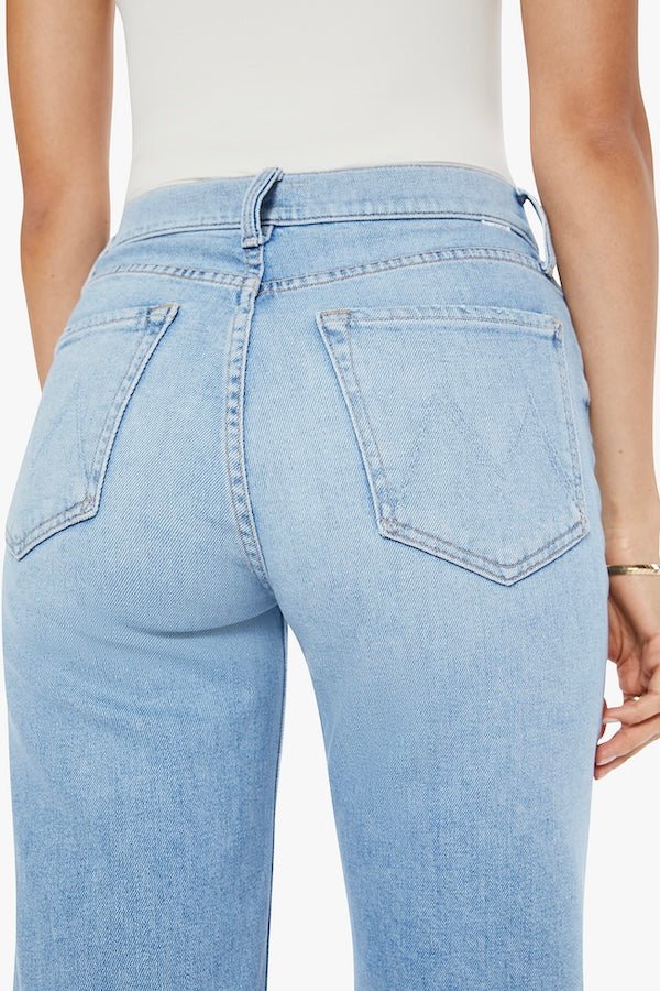 The Rambler Zip Ankle Look Ma, No Hands! by MOTHER, trendy high-waisted jeans with a wide leg and ankle cut. Perfect for a relaxed, stylish look with light-blue whiskering and fading.