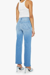 The Rambler Zip Flood Read Between The Lines by MOTHER, trendy high-waisted jeans with a wide straight leg, whiskering, and fading. Perfect for a stylish and comfortable look in a mid-blue wash.