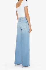 The Ditcher Roller Zip Sneak Can You Dig It? by MOTHER, trendy low-rise wide-leg jeans with a slouchy fit, dropped crotch, and light blue wash. Perfect for a relaxed, '70s-inspired look with whiskering and fading.