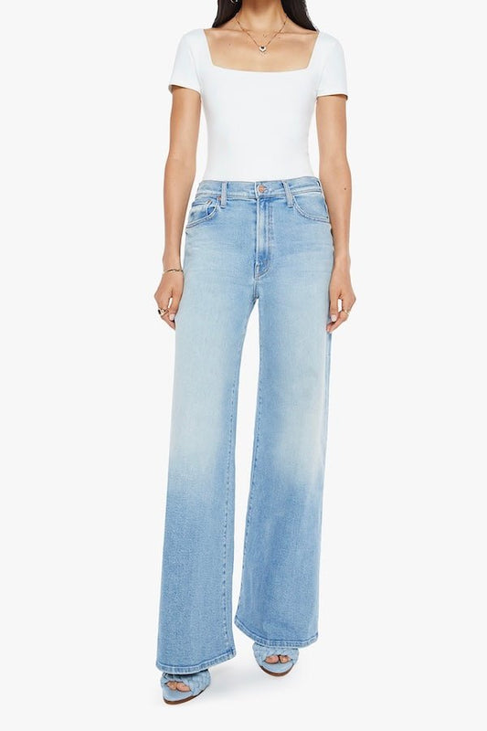 The Ditcher Roller Zip Sneak Can You Dig It? by MOTHER, trendy low-rise wide-leg jeans with a slouchy fit, dropped crotch, and light blue wash. Perfect for a relaxed, '70s-inspired look with whiskering and fading.
