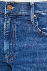 The Mid Rise Maven Sneak Over The Top by MOTHER, trendy mid-rise jeans with a relaxed wide-leg fit and subtle whiskering. Perfect for an effortlessly cool look with a vintage-inspired touch, crafted from recycled stretch denim.