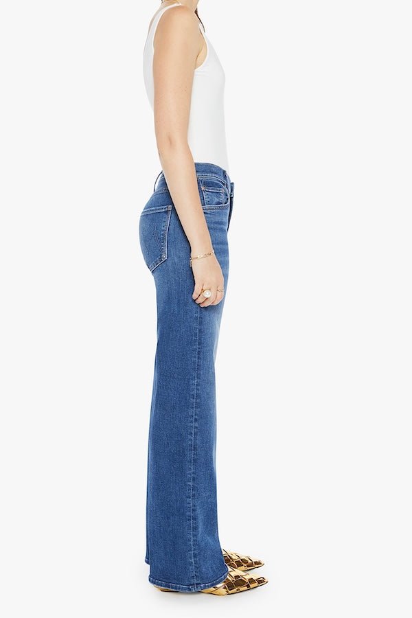 The Mid Rise Maven Sneak Over The Top by MOTHER, trendy mid-rise jeans with a relaxed wide-leg fit and subtle whiskering. Perfect for an effortlessly cool look with a vintage-inspired touch, crafted from recycled stretch denim.