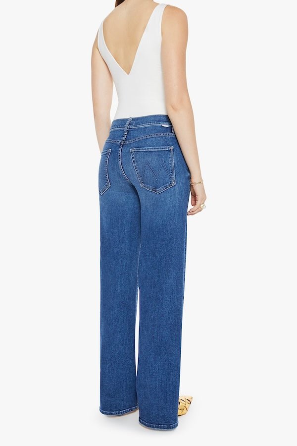 The Mid Rise Maven Sneak Over The Top by MOTHER, trendy mid-rise jeans with a relaxed wide-leg fit and subtle whiskering. Perfect for an effortlessly cool look with a vintage-inspired touch, crafted from recycled stretch denim.