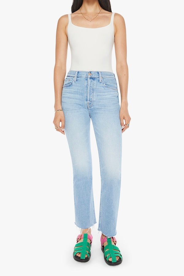 The Tripper Flood Fray Look Ma, No Hands! by MOTHER, trendy high-rise flare jeans with a button fly and frayed hem. Perfect for a stylish look with light-blue whiskering and fading.