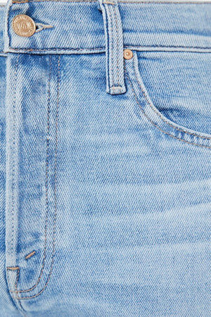 The Tripper Flood Fray Look Ma, No Hands! by MOTHER, trendy high-rise flare jeans with a button fly and frayed hem. Perfect for a stylish look with light-blue whiskering and fading.