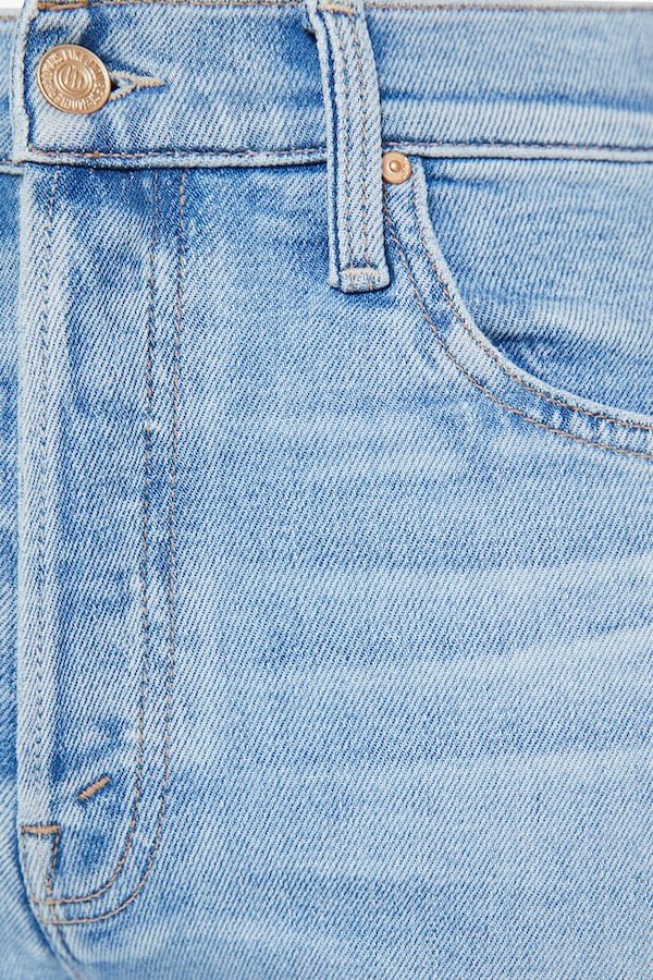 The Tripper Flood Fray Look Ma, No Hands! by MOTHER, trendy high-rise flare jeans with a button fly and frayed hem. Perfect for a stylish look with light-blue whiskering and fading.