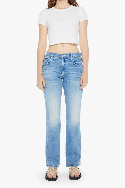 The Bookie Sneak Eye Of The Tiger by MOTHER, trendy high-rise bootcut jeans with a fitted hip and looser leg. Perfect for a relaxed, stylish look with whiskering and fading at the knees.