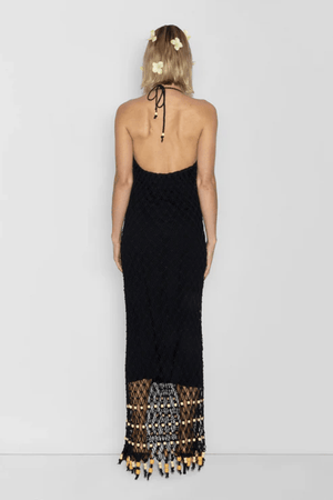 Reis Macrame Maxi Dress Noir by The Wolf Gang – Striking handmade black macrame dress with beaded hem, ideal for festivals or summer soirées.