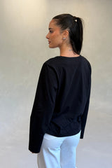 Carter V Neck Long Sleeve Top in Black by Sneaky Link, cotton V-neck long sleeve top for effortless everyday layering.

