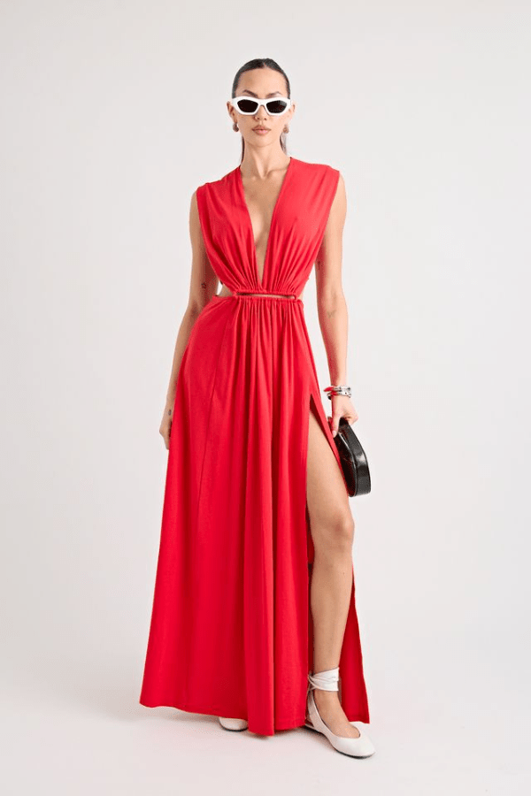 Do For Love Gown Red by Pfeiffer – A trendy low plunge maxi gown with bold hardware and thigh-high split, perfect for turning heads at special occasions.