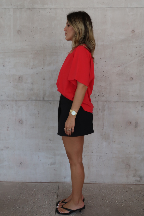 Sneaky Mini Skirt Black by Sneaky Link – A-line high-waisted mini with boned waist and flap pockets, perfect for day-to-night styling.