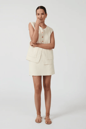 Helena Gilet Ivory by Onte, breathable cotton crochet knit with gold buttons and patch pockets, perfect for trendy layering and elegant casual wear.