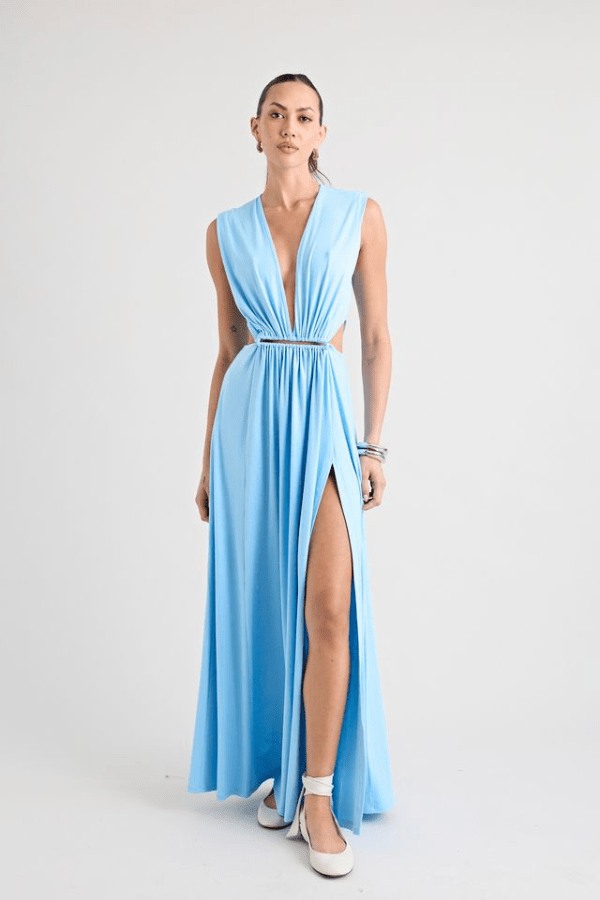 Do For Love Gown Light Blue by Pfeiffer – A trendy, elegant maxi with a deep plunge, thigh-high split, and bold hardware, perfect for special occasions and evening events.