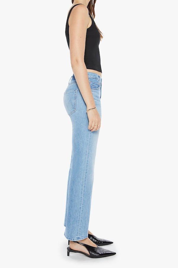 The Bookie Flood Puzzled by MOTHER, trendy high-rise bootcut jeans with a looser leg and whiskering at the knees. Perfect for a relaxed yet stylish look, made from semi-rigid denim that softens over time.