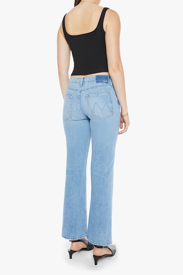 The Bookie Flood Puzzled by MOTHER, trendy high-rise bootcut jeans with a looser leg and whiskering at the knees. Perfect for a relaxed yet stylish look, made from semi-rigid denim that softens over time.