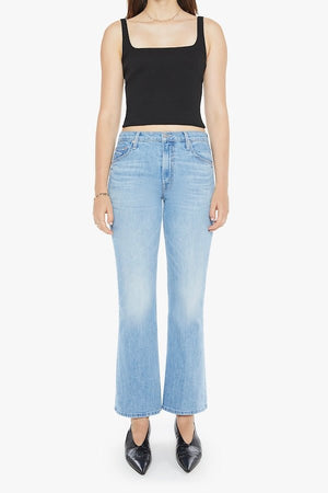 The Bookie Flood Puzzled by MOTHER, trendy high-rise bootcut jeans with a looser leg and whiskering at the knees. Perfect for a relaxed yet stylish look, made from semi-rigid denim that softens over time.