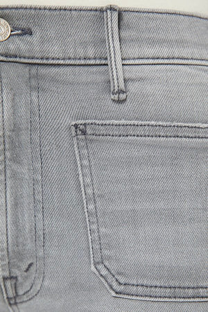 The Hustler Roller Patch Pocket Sneak Noted! by MOTHER, trendy 70s-inspired wide-leg jeans with a high rise and patch pockets. Perfect for a relaxed, stylish look in faded light grey with a clean hem.