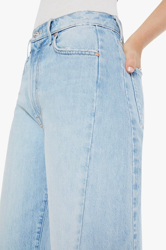 The Full Pipe Flood Back Pedal by MOTHER, trendy super high-waisted jeans with a full barrel leg and distressed details. Perfect for a relaxed, vintage-inspired look with a light blue wash.
