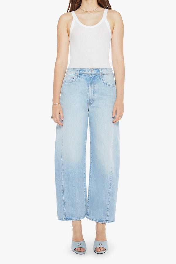 The Full Pipe Flood Back Pedal by MOTHER, trendy super high-waisted jeans with a full barrel leg and distressed details. Perfect for a relaxed, vintage-inspired look with a light blue wash.