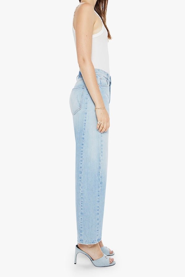 The Full Pipe Flood Back Pedal by MOTHER, trendy super high-waisted jeans with a full barrel leg and distressed details. Perfect for a relaxed, vintage-inspired look with a light blue wash.