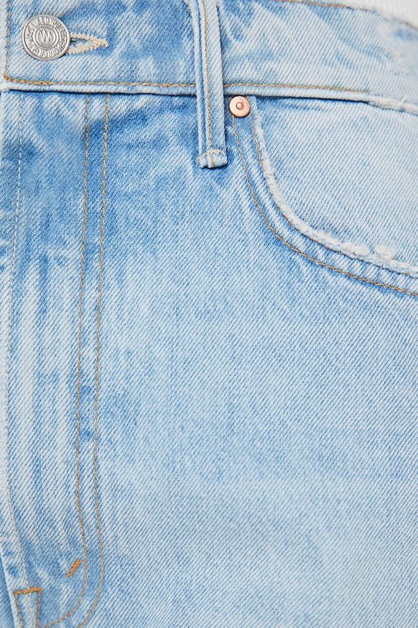 The Full Pipe Flood Back Pedal by MOTHER, trendy super high-waisted jeans with a full barrel leg and distressed details. Perfect for a relaxed, vintage-inspired look with a light blue wash.