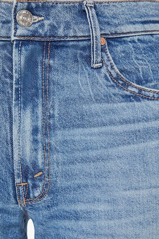 The Mid Rise Tunnel Vision Sneak I'm A Winner by MOTHER, trendy mid-rise jeans with a loose straight leg, featuring whiskering and fading at the knees. Perfect for a relaxed yet stylish look in a semi-rigid denim that softens with wear.